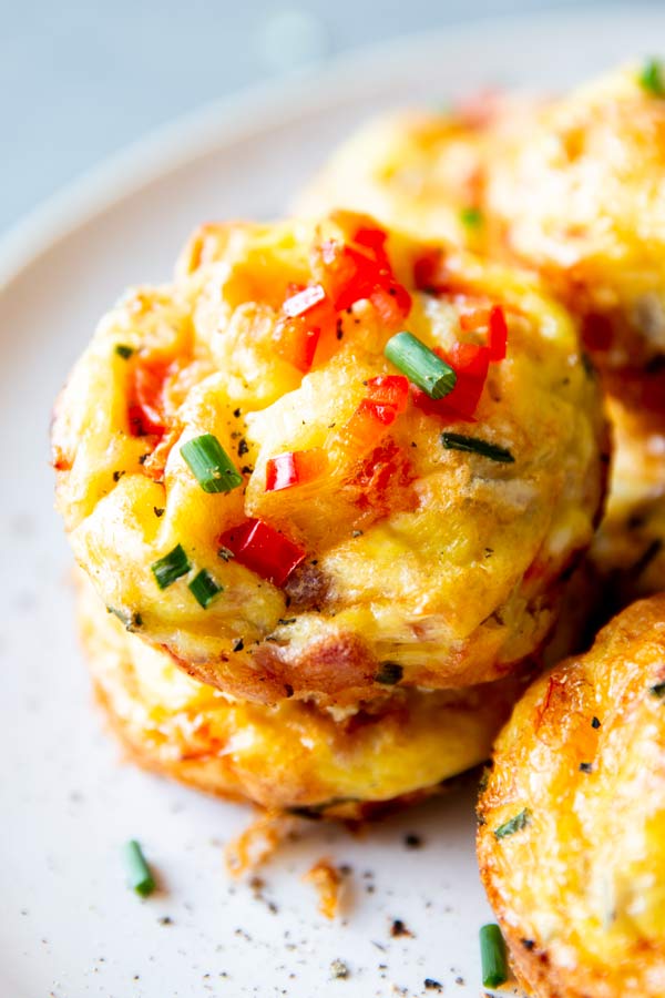 close up photo of bacon cheddar chive egg breakfast muffins